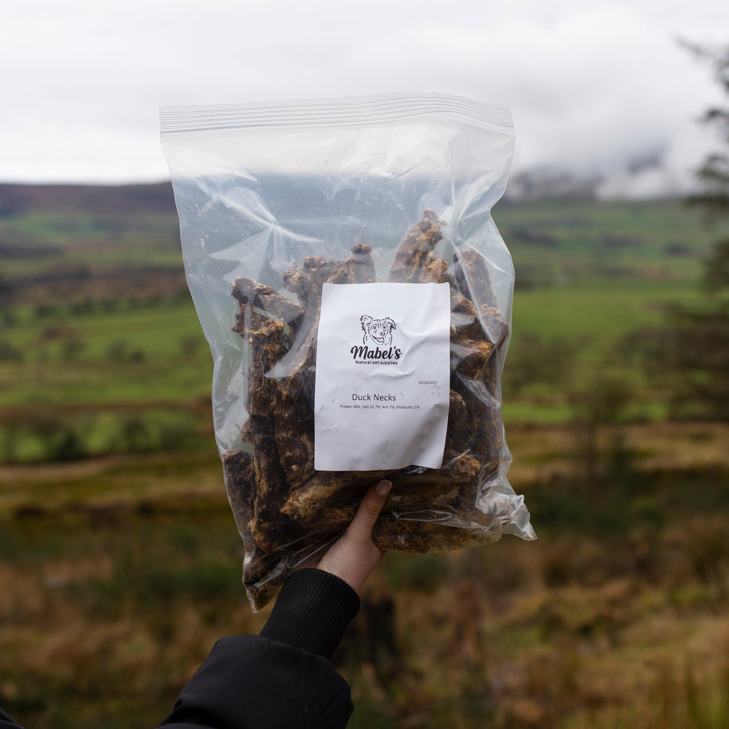 Mabel's Natural Pet Supplies™ duck necks dog treats in 1kg or 500g bags, showing fresh, whole duck necks for dogs.