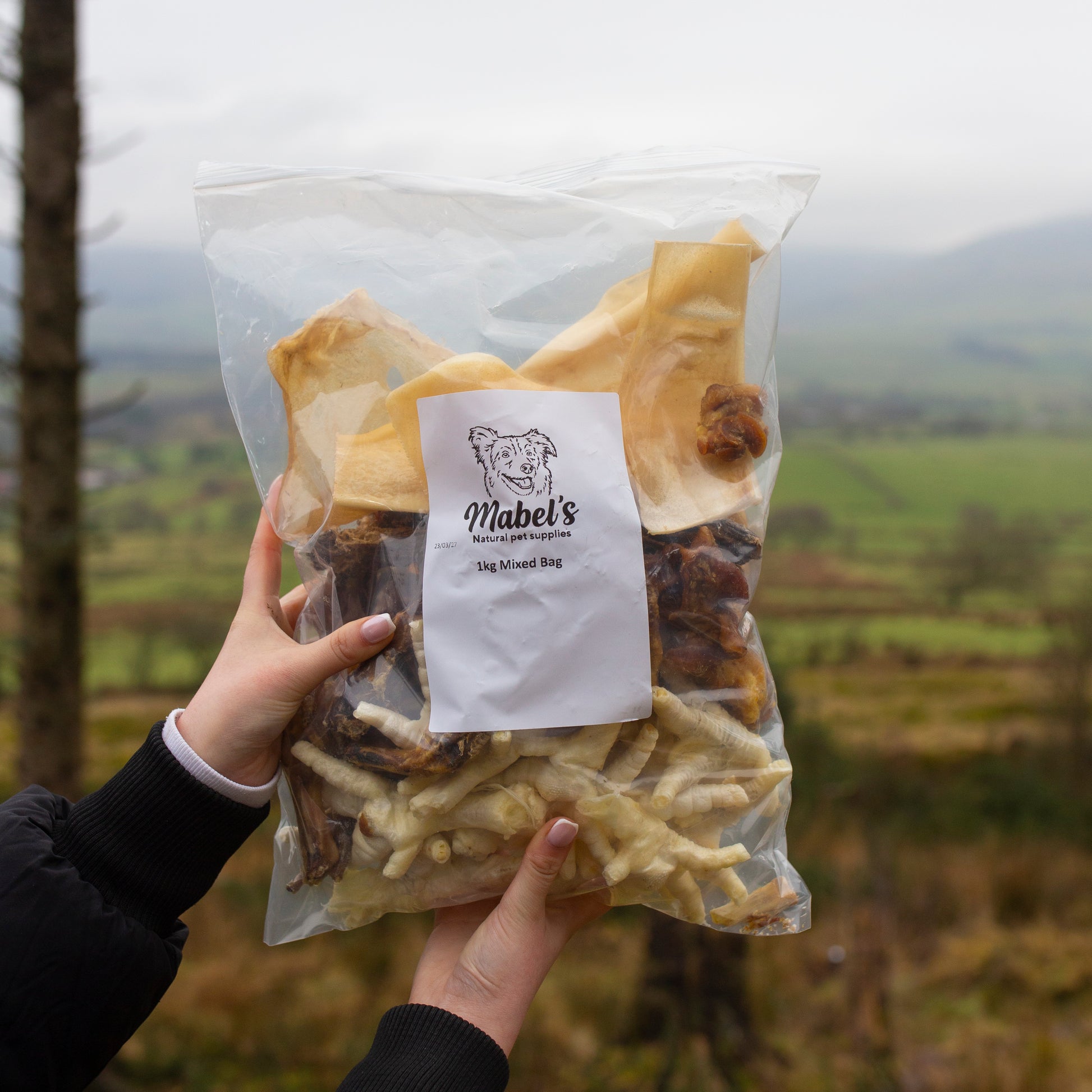 Assorted Mabel's Natural Pet Supplies™ 1kg dog treat bundle with pork crunch, chicken feet, puffed chicken, beef skin, and duck necks.